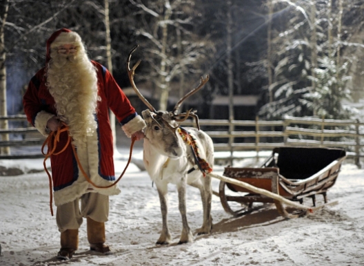 show me a picture of santa and his reindeer